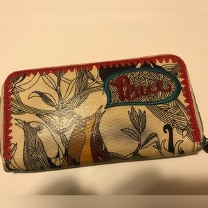 Women’s wallet. Has been lovingly used. Very spacious for storage.